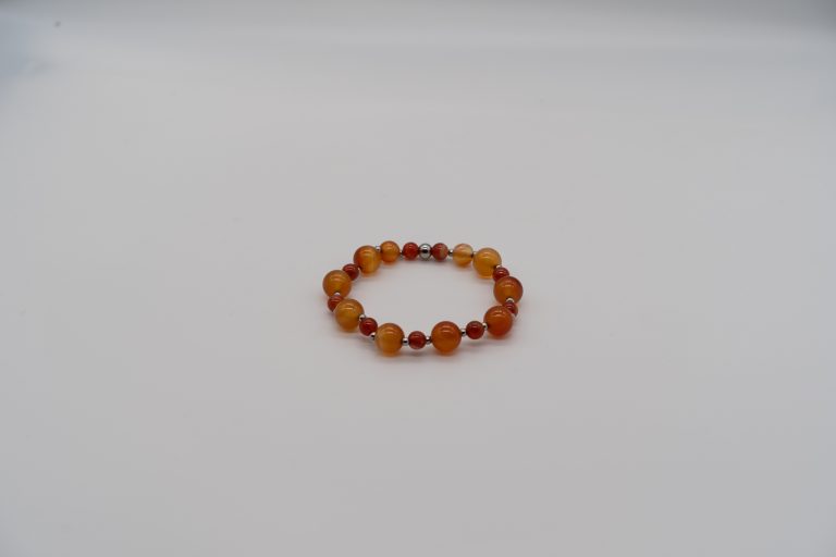 The Carnelian Happy Crystal Bracelet is handcrafted with: