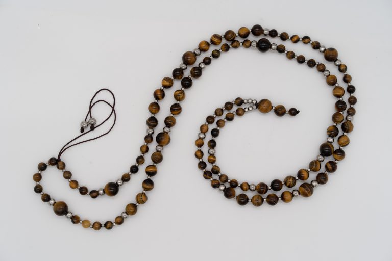 This Tiger’s Eye Happy Crystal Mala Necklace is hand-crafted with: