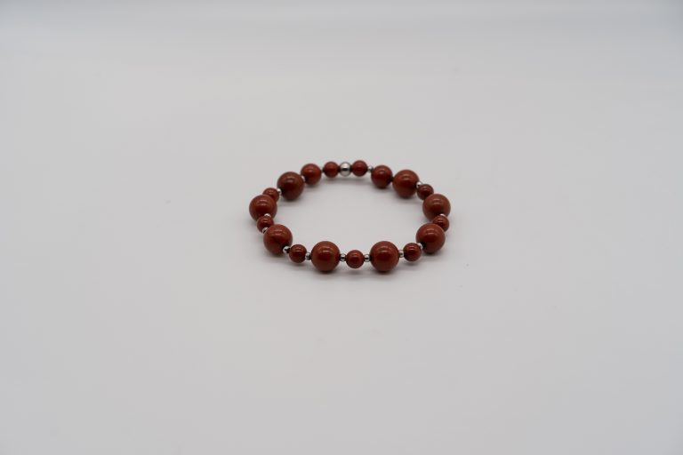 The Red Jasper Happy Crystal Bracelet is handcrafted with: