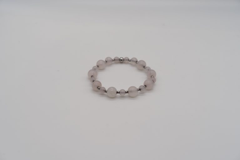 The Rose Quartz Happy Crystal Bracelet is handcrafted with: