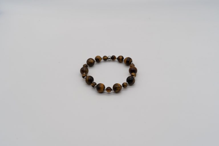 The Tiger’s Eye Happy Crystal Bracelet is handcrafted with: